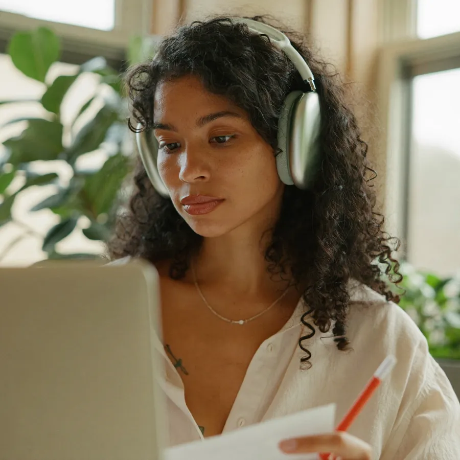 Tutor listening to an experienced professional during an online session